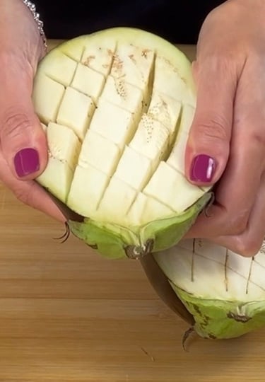 Score the eggplants