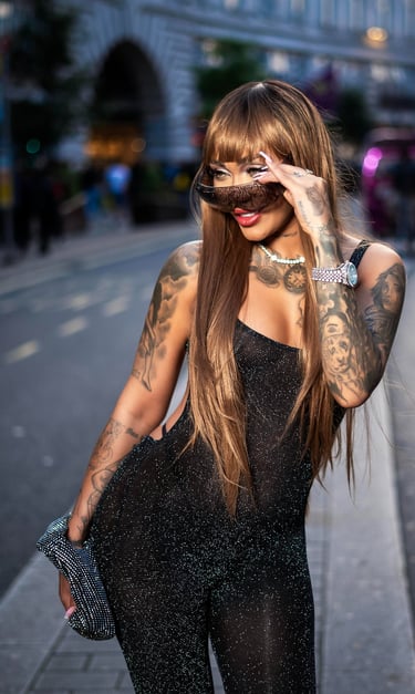 Model in black jumpsuit posing on Oxford street, captured by Fred Art Studio.