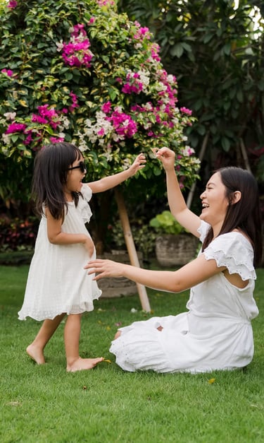 Candid portrait of sisters playing together outdoors during a natural family photography session at a private villa in Bali.