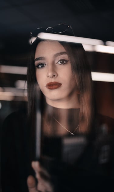 a woman with a black top and sunglasses on