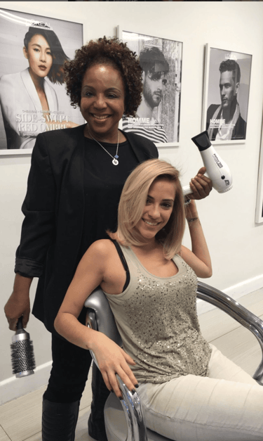 Finished layered haircut with soft waves by Francis Hair & More in Miami