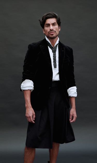 Dany Peña in formal black-and-white outfit