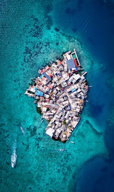 a small island with a small island in the middle of the ocean