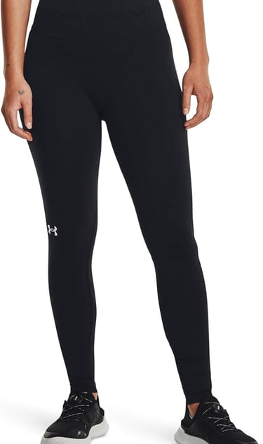 a woman in a black sports bracquett and black leggings