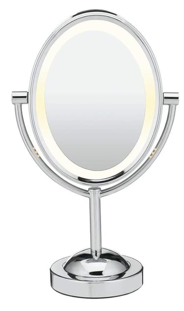 a mirror with a lighted up makeup mirror