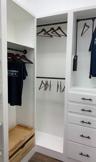 closet with roll out trays and hanging rods 