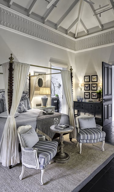 a bedroom with a canopy bed and a canopy bed