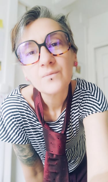 a woman with glasses and a tie dye dye dye dye dye dye dye dye dye