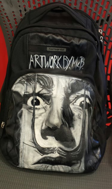 Freehand airbrush painting on a backpack
