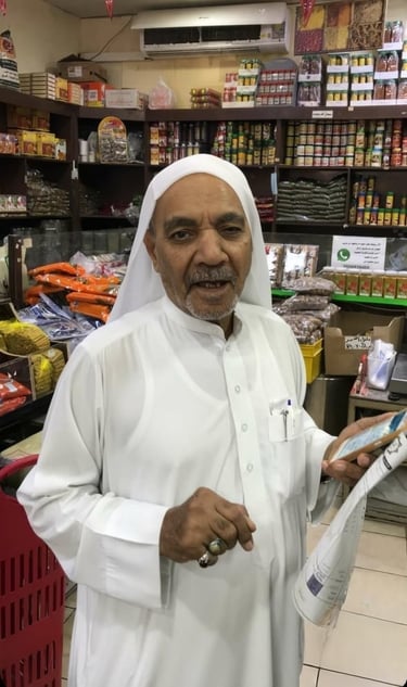 a man in a white robe holding a newspaper