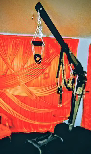 SUSPENSION CRANE  with a red curtain