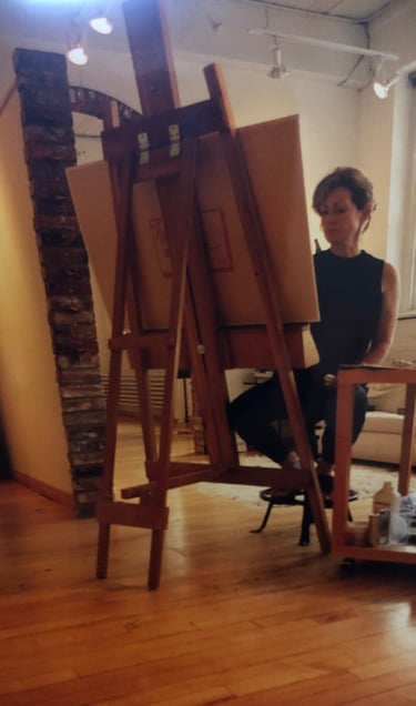 Sandra Forzani painting in her studio