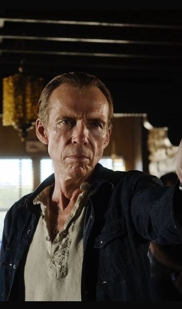 a man holding a gun in a room