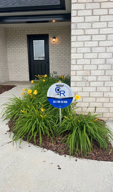 a sign that says,'C and R Security solutions,'the sign is for the security company that protects