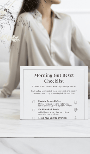 Printable gut health reset checklist with a woman sitting on a bed, supporting digestive wellness an