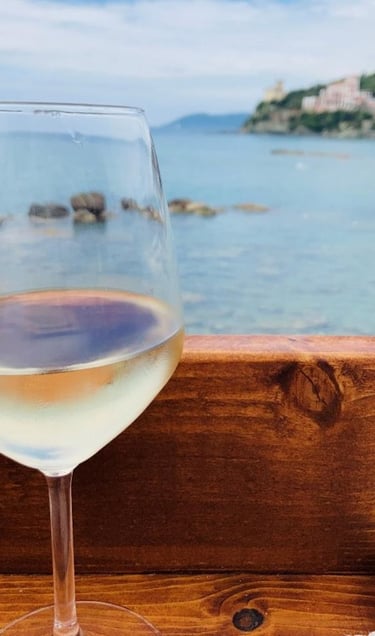 a glass of wine on a wooden table