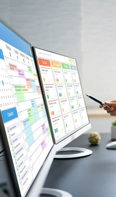 Project Management screens on computer monitors
