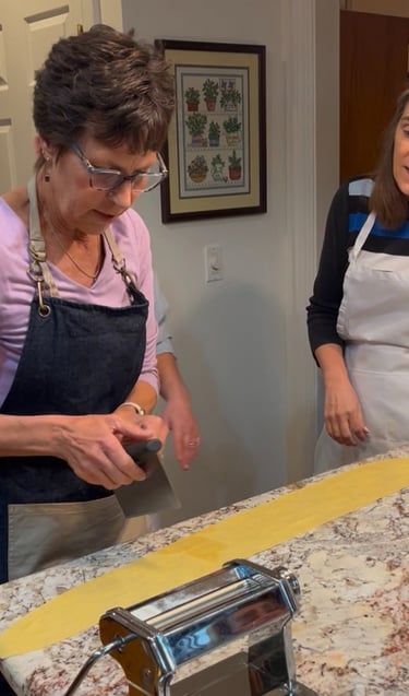 Michele demonstrating how to cut a fresh handmade pasta noodle