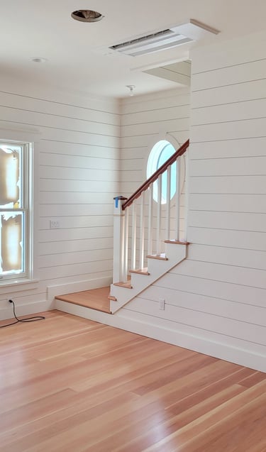 Shiplap paneling with stair system and fir flooring