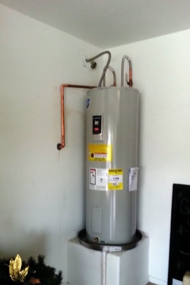 a water heater with a water heater on top of it