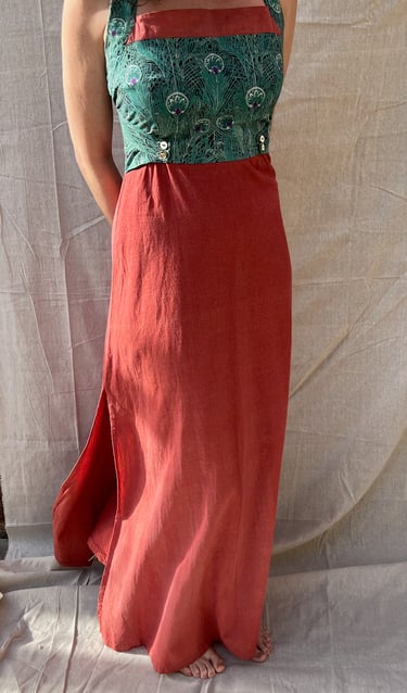 The front of a green and amber maxi dress