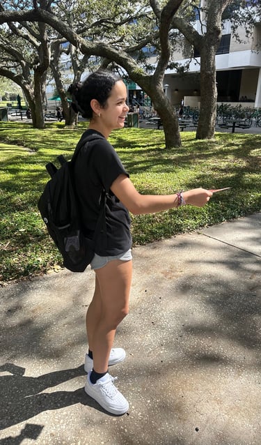 Student handing out flyers on campus