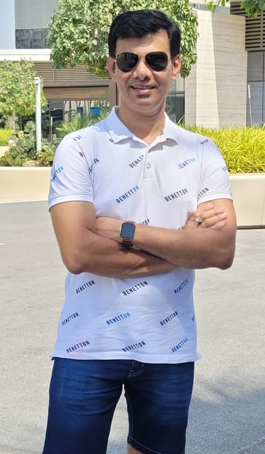 a man in a white shirt and blue shorts, raheel ahmed