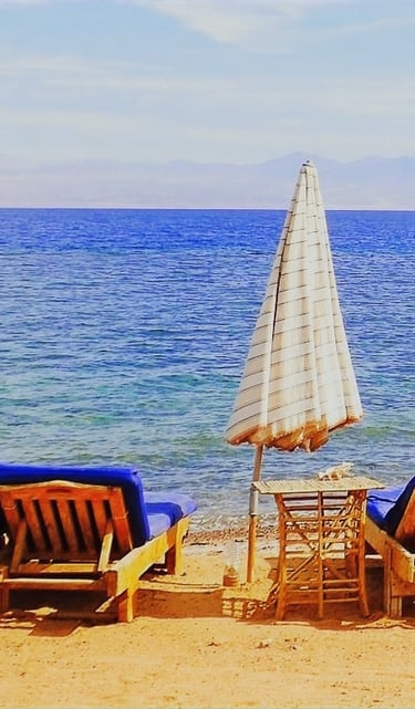 Relaxing in front of the sea on our chaise lounge