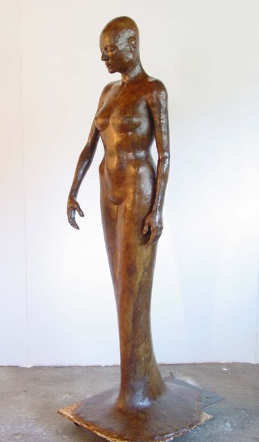 a wax model of a woman standing in a dress