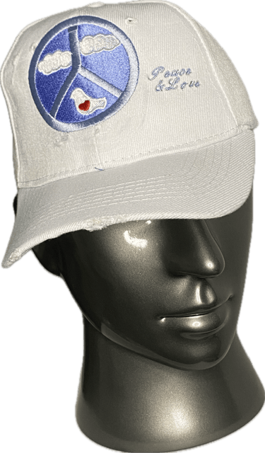 White baseball cap with embroidered blue peace sign and Peace and Love text on a mannequin head.