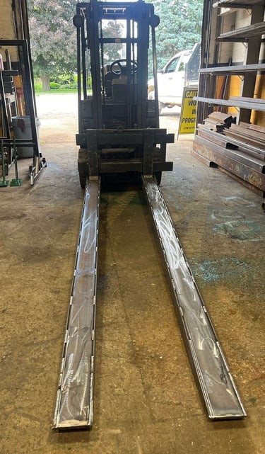 Custom steel fabricated fork lift fork extensions