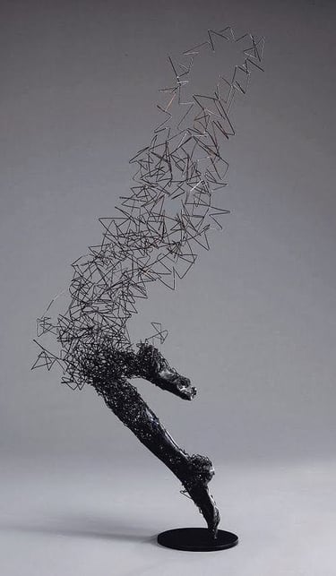 a sculpture of a horse running through a field