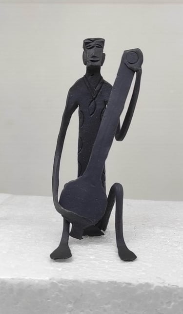 "Handcrafted iron tribal man playing Tanpura–sitting view-for export"