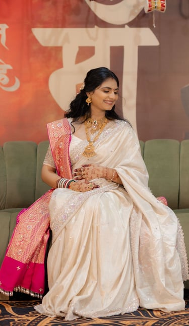 Close-up of a radiant bride's makeup being perfected by R&D Bridal Studio artist for her baby shower