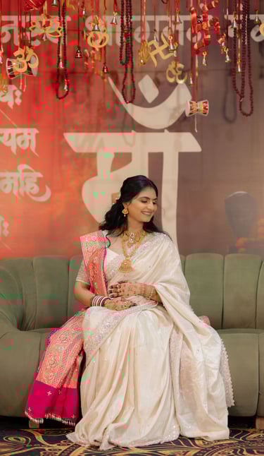 Close-up of a radiant bride's makeup being perfected by R&D Bridal Studio artist for her baby shower