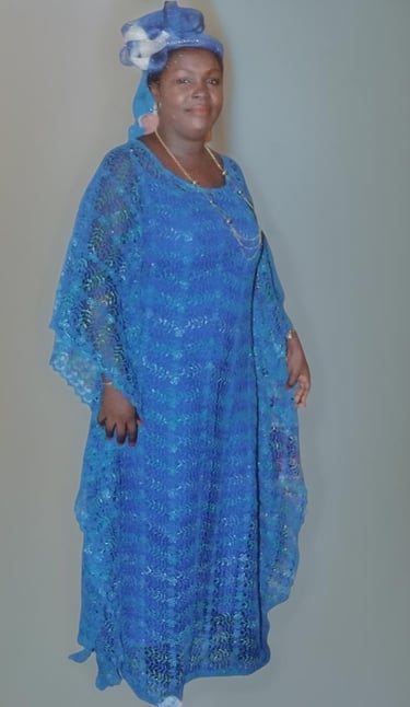 a woman in a blue dress and hat with a blue dress