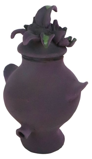 a purple vase with flowers on it