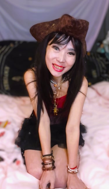 Asian woman posing on a bed