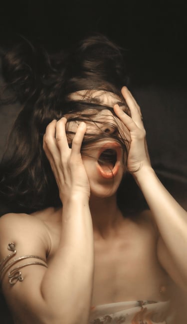 a portrait of a woman holding her head with her hands, she have a mouth open 