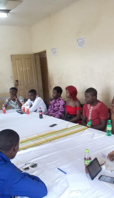 a group of people sitting around a table