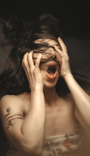 a portrait of a woman holding her head with her hands, she have a mouth open 