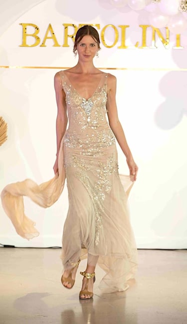 Models wearing elegant wedding gowns at a Las Vegas fashion show