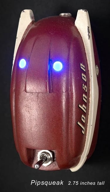 Found object robot head built by artist Tal Avitzur from model of outboard engine.