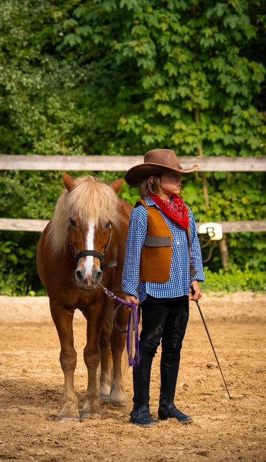 a boy in a cowboy hat and a horse