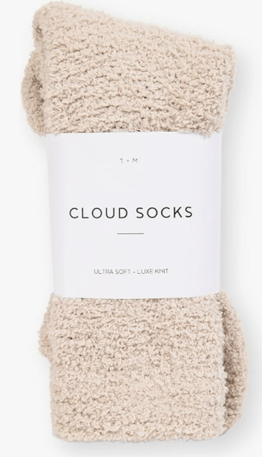 pair of new cream fluffy socks still in packaging