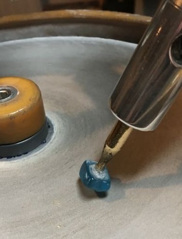 Faceting a gemstone stone on dop