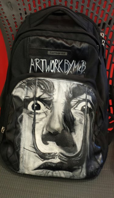 Freehand airbrush painting on a backpack
