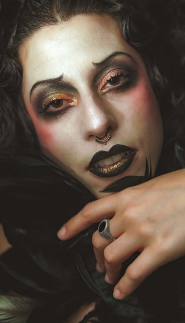 a cabaret performer with a black and white makeup and a black and white makeup