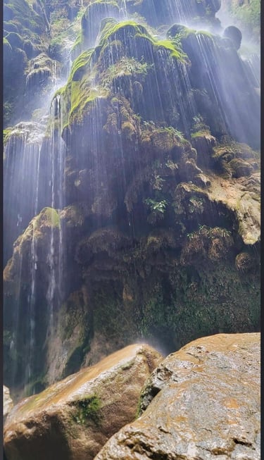 Umbrella waterfall in the middle of a mountain