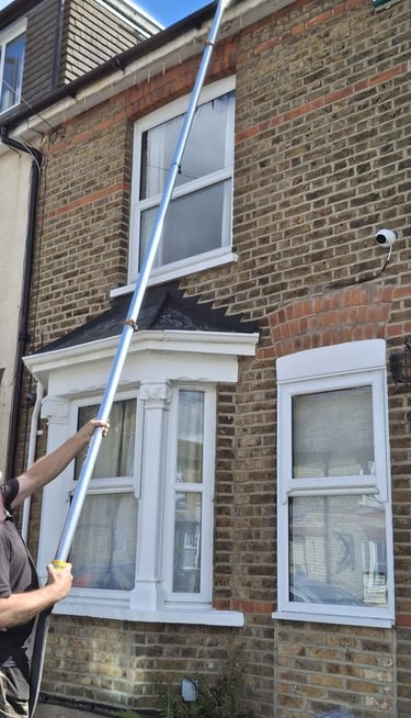 Gutter vacuum cleaning system in use in Hoddesdon